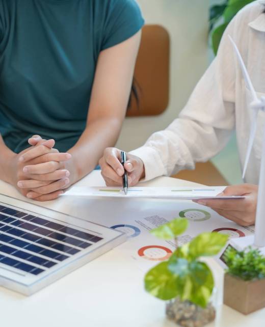 Solar panels green energy Business people working in green eco friendly office business meeting creative ideas for business eco friendly professional teaching corporate people sustainable electricity.